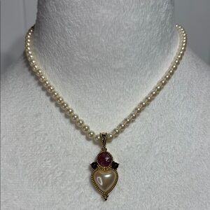 Faux pearl necklace with pearl and purple pendant